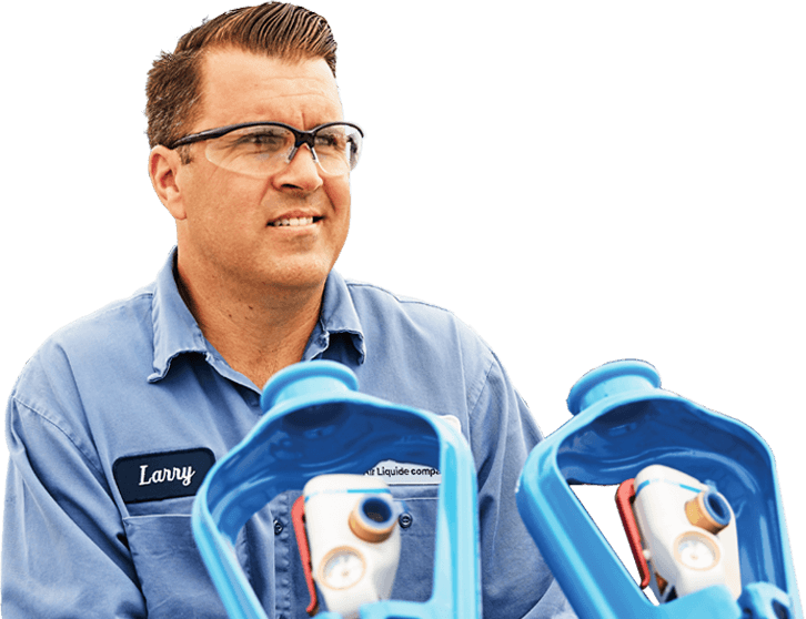Airgas employee Larry pushes two gas cylinders & thinks about how customers shop for products to help fill their potential.